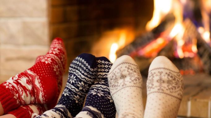 14507011-feet-in-wool-socks-near-fireplace-in-winter-time